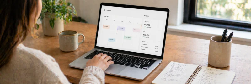 Laptop and planner showing time blocks and income tracking for online side hustles