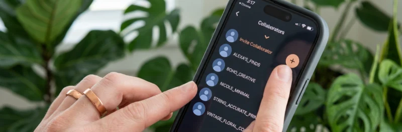 A person holding a smartphone showing a list of collaborators on a Pinterest board, illustrating Pinterest collaborative boards in 2026.