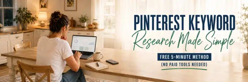 woman doing Pinterest keyword research on a laptop at a kitchen table