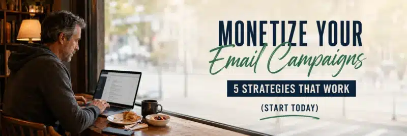 Man at a café table on a laptop working through ways to monetize your email campaigns