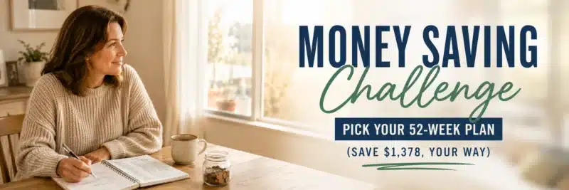 woman tracking her money saving challenge progress in a notebook